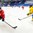 SOCHI, RUSSIA - APRIL 20: Switzerland's Luca Hischier #13 carries the puck in the offensive zone, Sweden's Andreas Borgman #10 defends during preliminary round action at the 2013 IIHF Ice Hockey U18 World Championship. (Photo by Matthew Murnaghan/HHOF-IIHF Images)